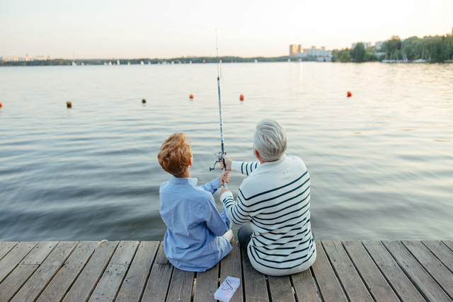 couple fishing off a dock